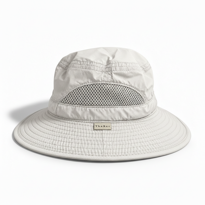 The Canopy packable bucket hat worn outdoors, Clear Sky colourway